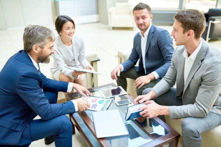 team-of-cheerful-business-people-in-meeting